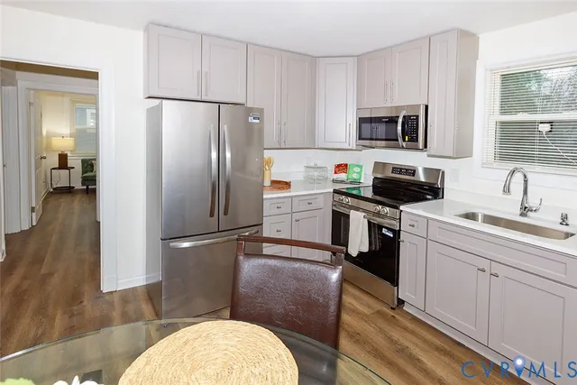 a bedroom with bed and a chair