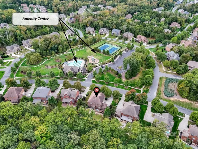 an outdoor space with lots of trees and flowers