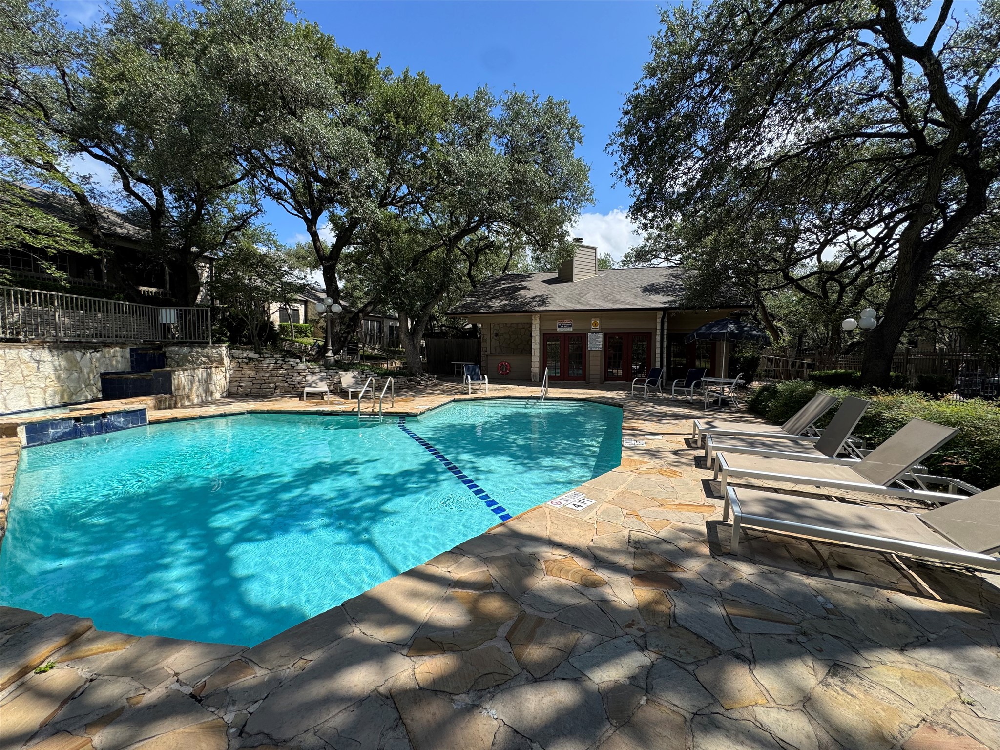 3809 Spicewood Springs Road, Unit 137 Austin, TX 78759 - Photo 30 of 34 The association club house and sauna are also here. Love those loungers!