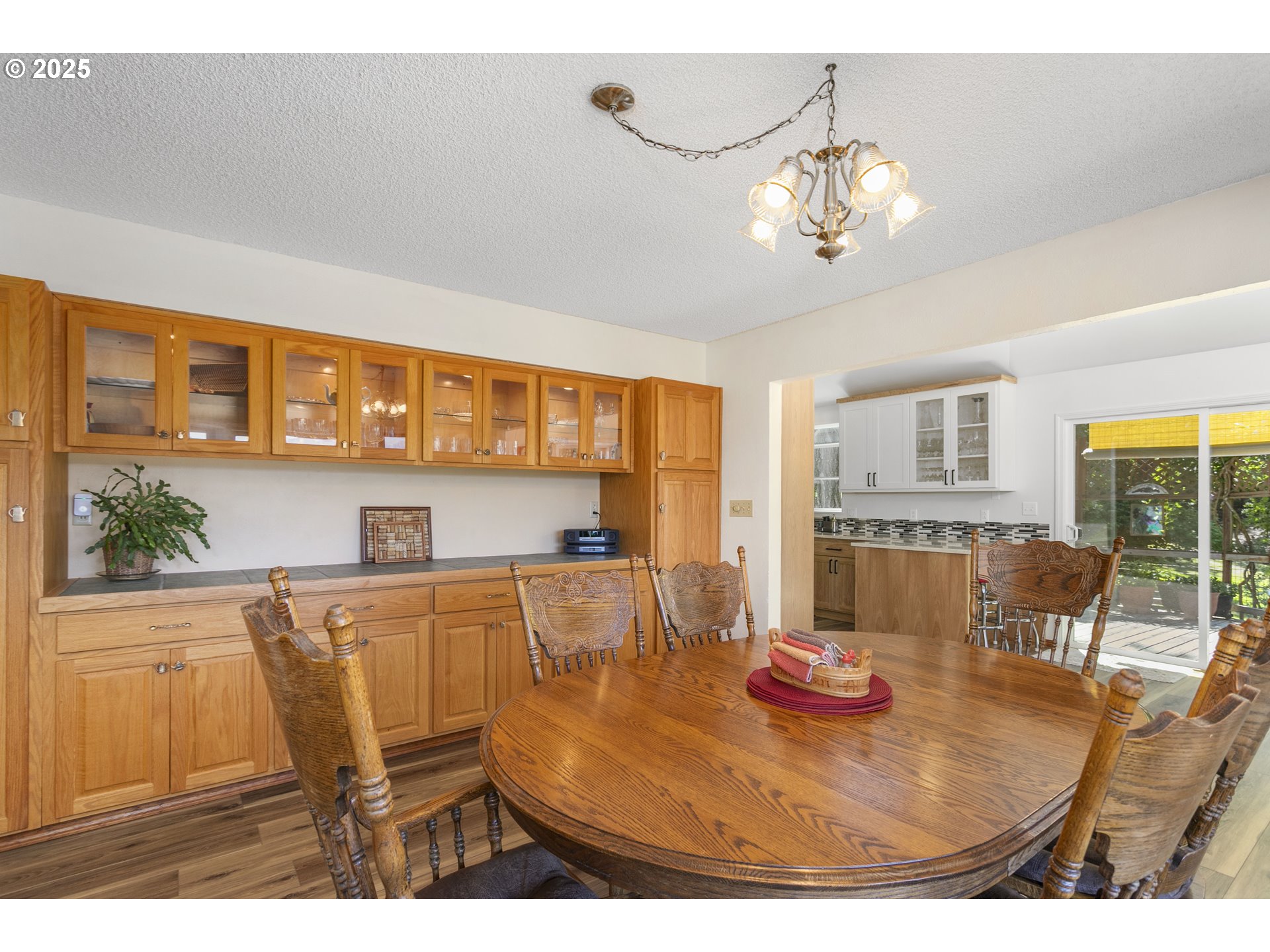 36589 Alder Branch Road Springfield, OR 97478 - Photo 14 of 36 a view of a dining room with furniture and a chandelier