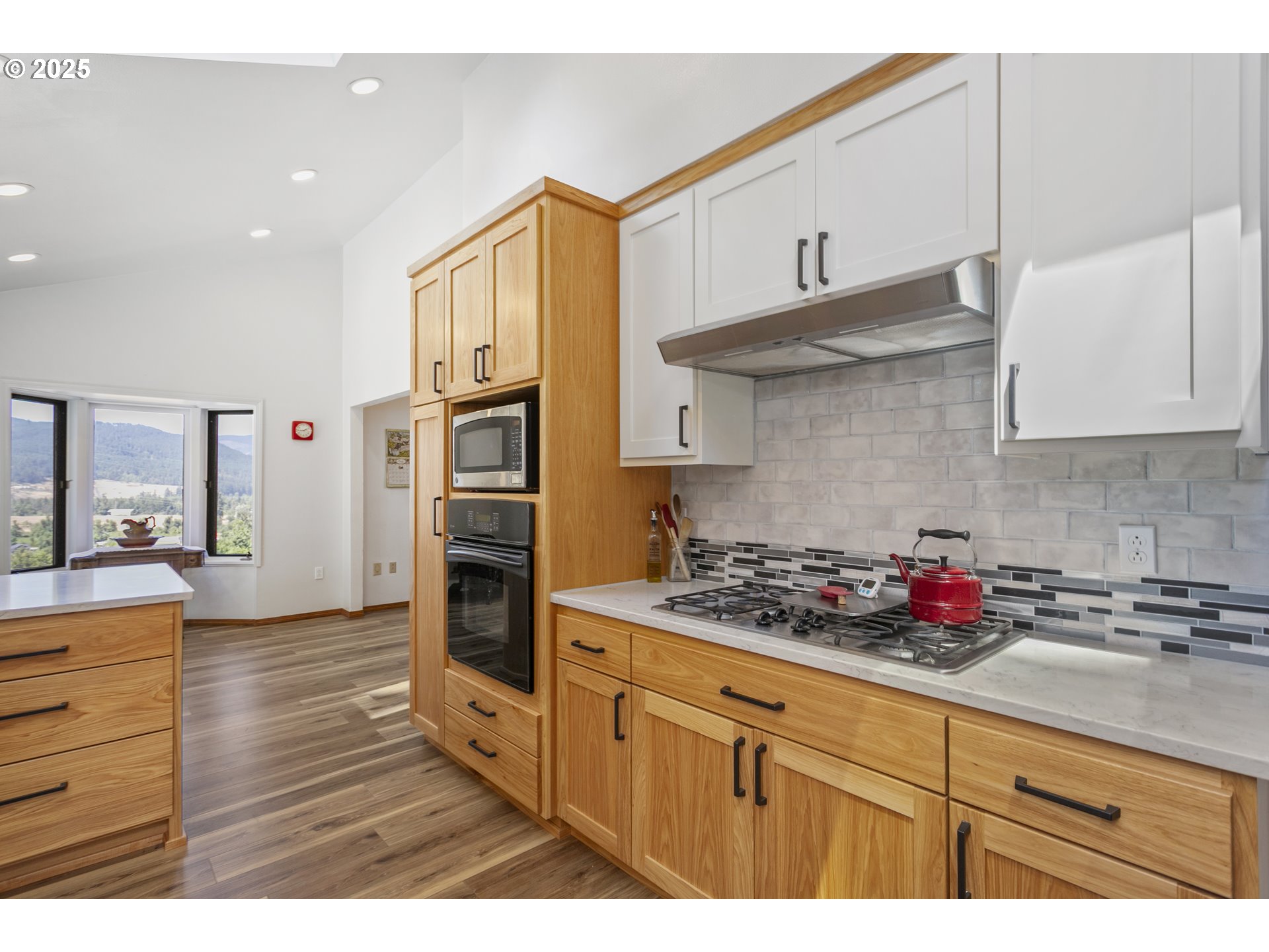 36589 Alder Branch Road Springfield, OR 97478 - Photo 17 of 36 a kitchen with stainless steel appliances granite countertop a stove and cabinets