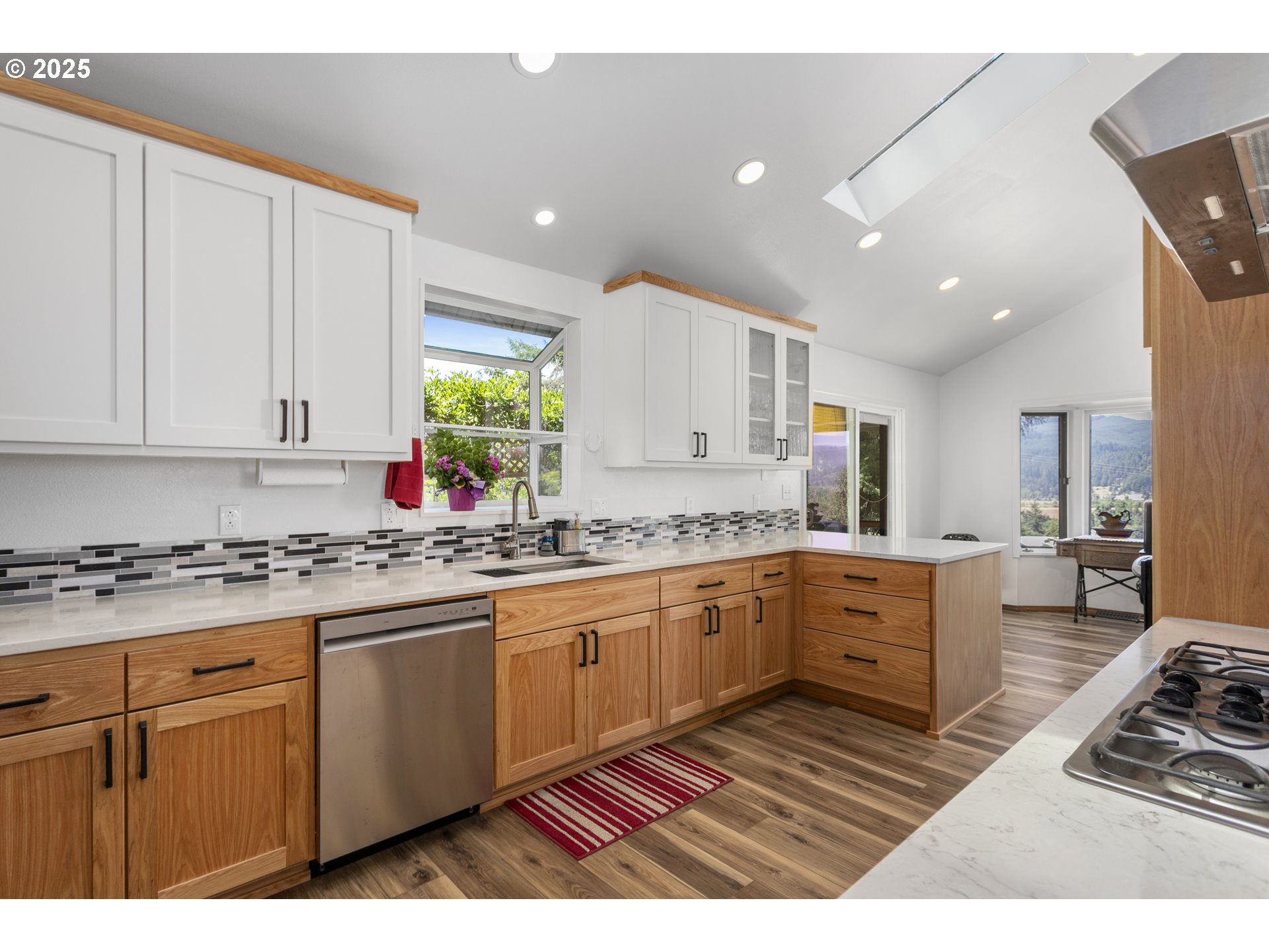 36589 Alder Branch Road Springfield, OR 97478 - Photo 18 of 36 a kitchen with granite countertop a sink cabinets and window