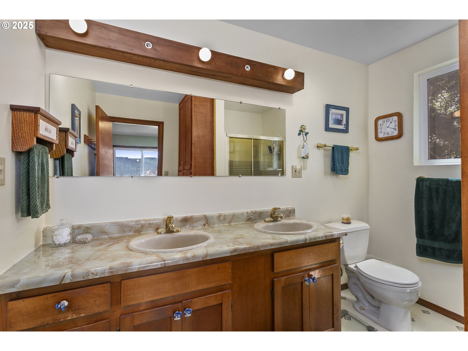 36589 Alder Branch Road Springfield, OR 97478 - Photo 22 of 36 a bathroom with a granite countertop sink mirror and toilet
