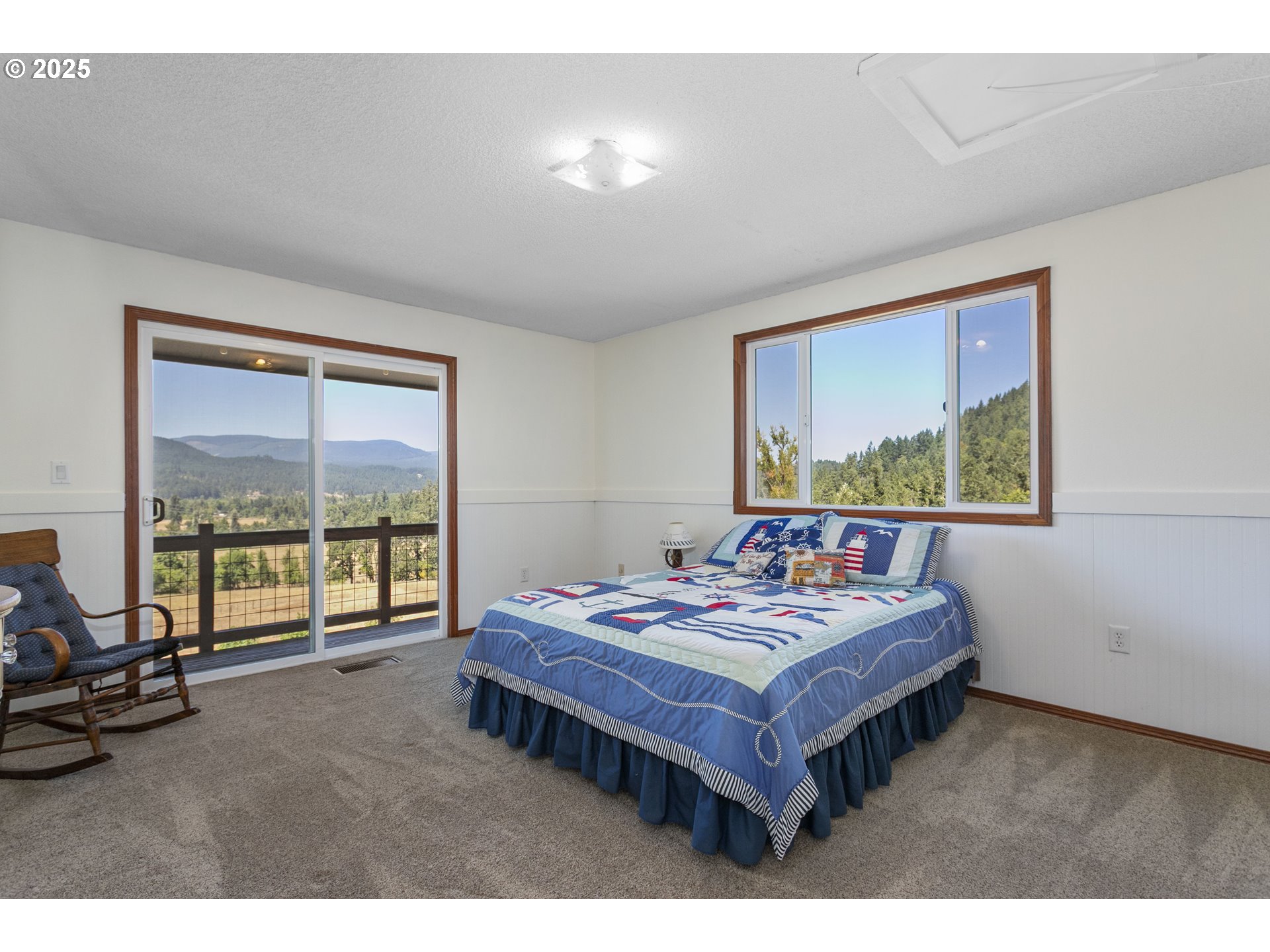 36589 Alder Branch Road Springfield, OR 97478 - Photo 25 of 36 a living room with furniture and a floor to ceiling window