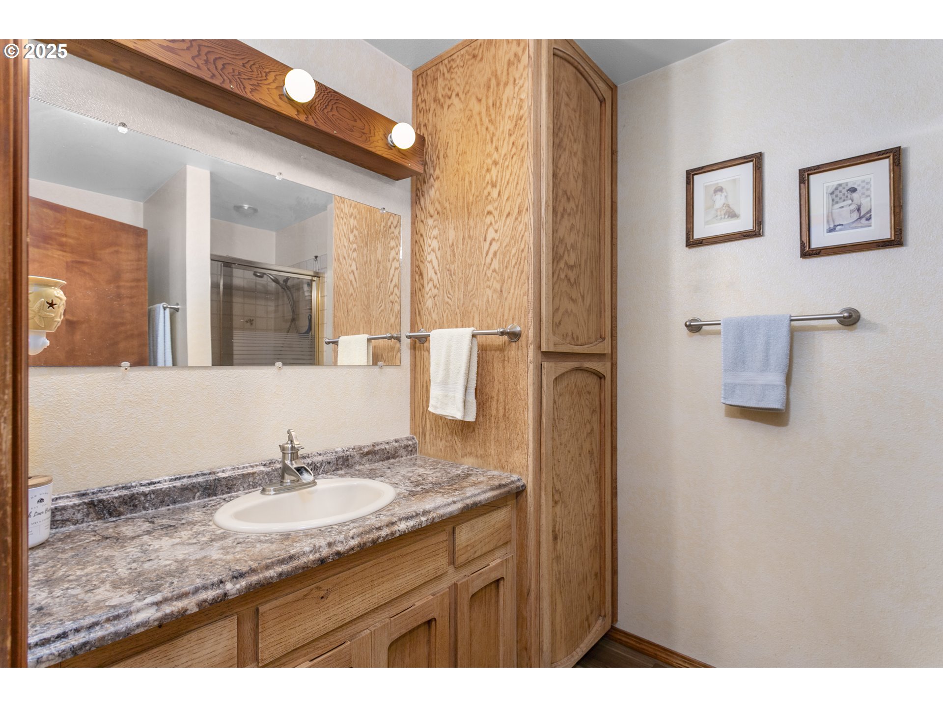 36589 Alder Branch Road Springfield, OR 97478 - Photo 28 of 36 a bathroom with a granite countertop sink and a mirror