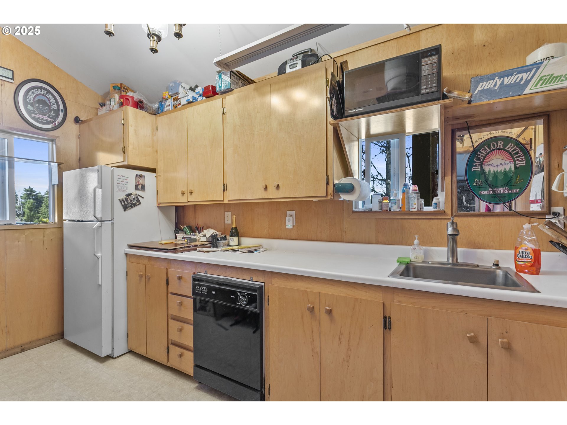 36589 Alder Branch Road Springfield, OR 97478 - Photo 33 of 36 a kitchen with a sink and a refrigerator
