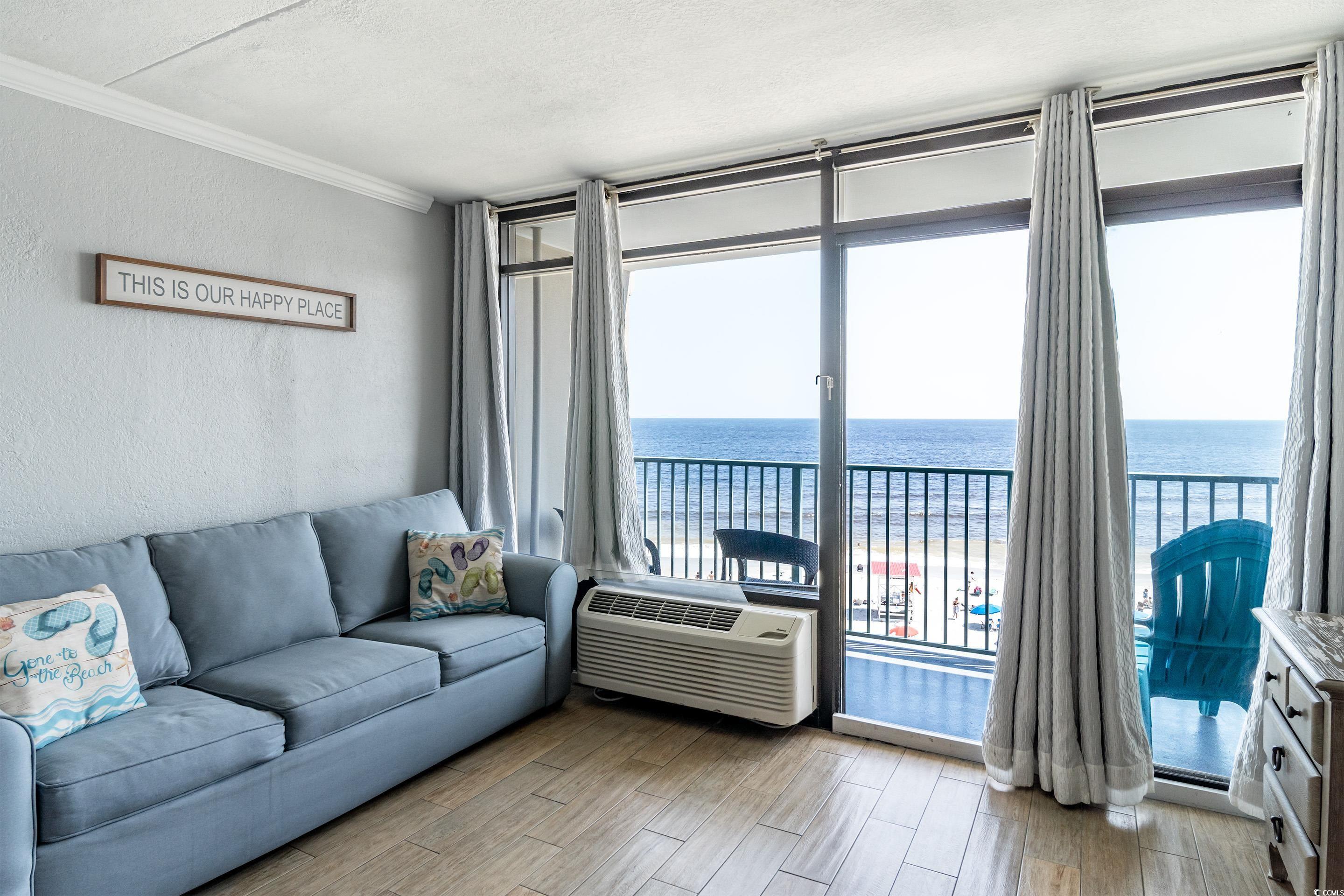 201 74th Avenue North, Unit 2532 Myrtle Beach, SC 29572 - Photo 11 of 39 Living room featuring a wealth of natural light, l