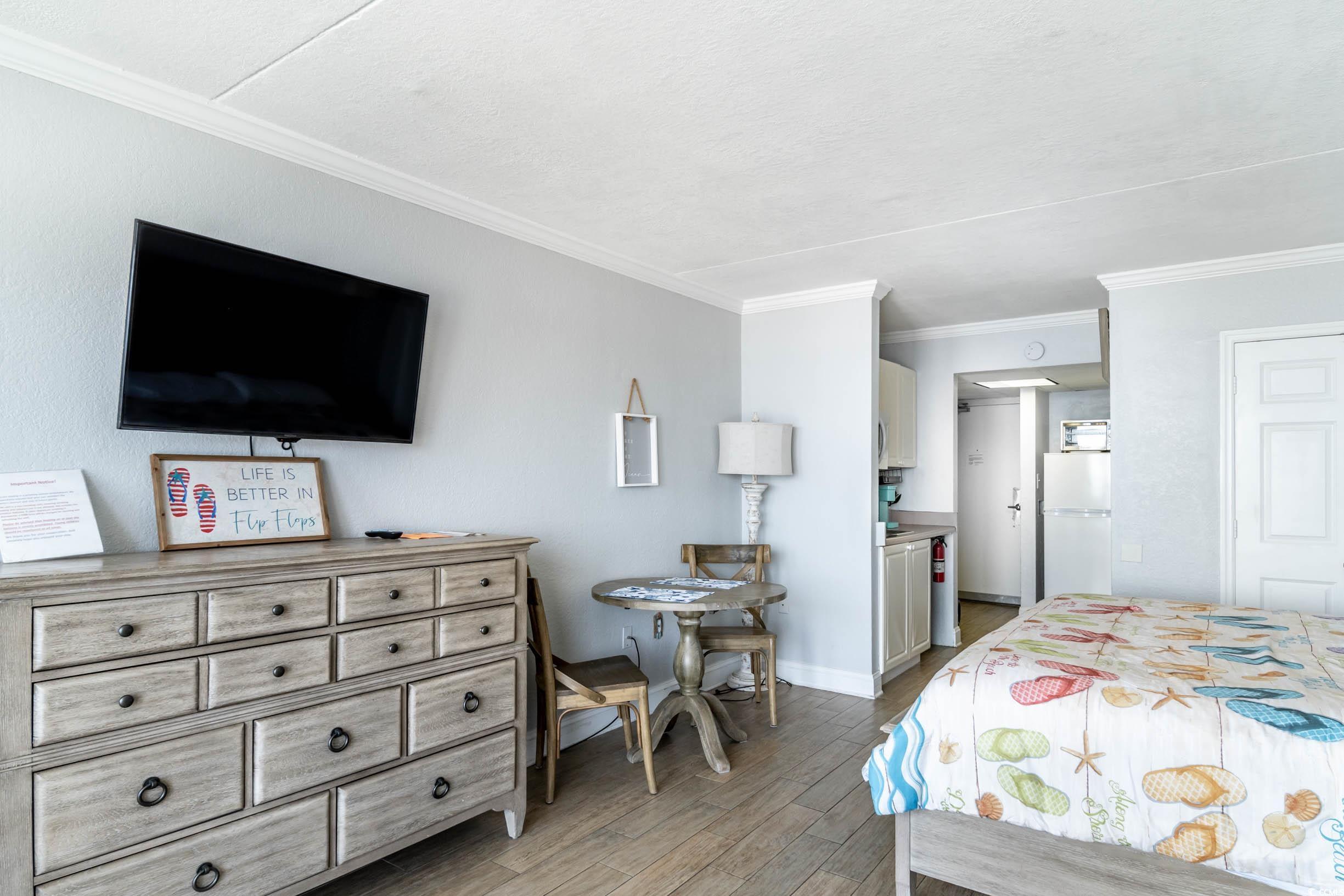 201 74th Avenue North, Unit 2532 Myrtle Beach, SC 29572 - Photo 3 of 39 Bedroom featuring crown molding, white fridge, and