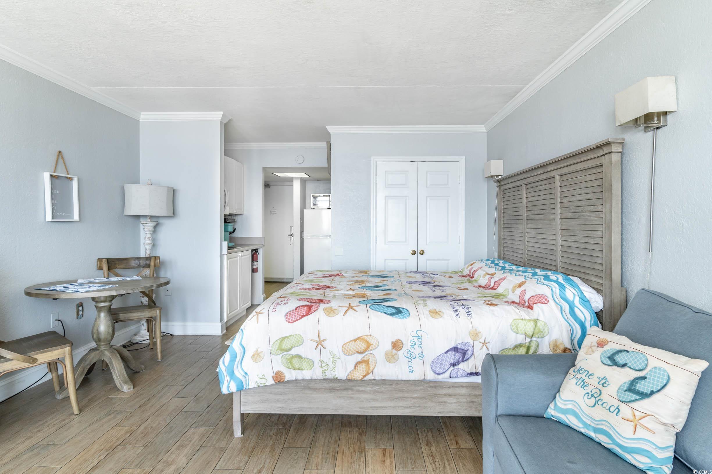 201 74th Avenue North, Unit 2532 Myrtle Beach, SC 29572 - Photo 6 of 39 Bedroom with wood-type flooring, white fridge, a c