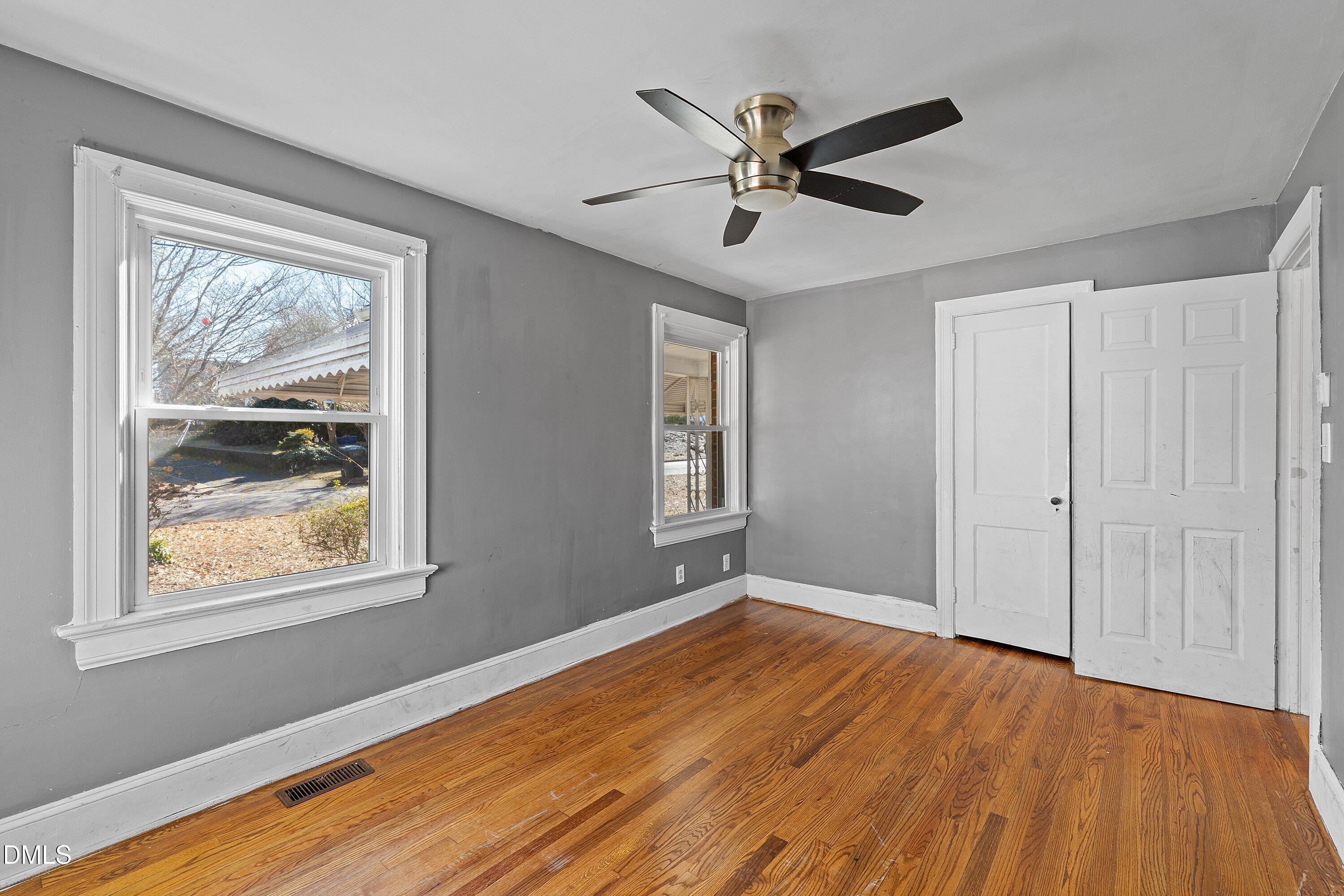 1205 Watauga Street Raleigh, NC 27604 - Photo 19 of 26 a view of an empty room with wooden floor and a window