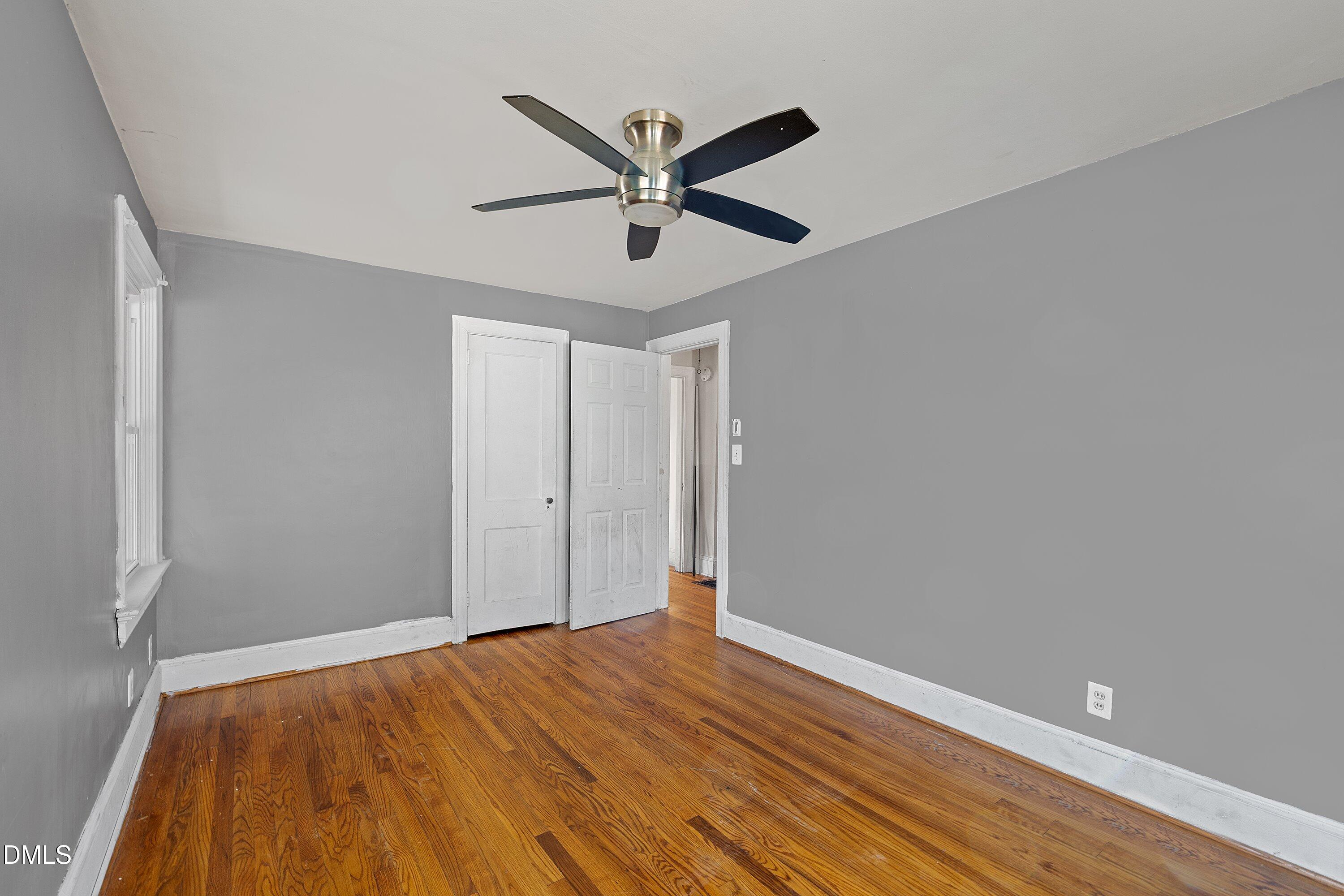 1205 Watauga Street Raleigh, NC 27604 - Photo 20 of 26 a view of empty room with wooden floor and ceiling fan