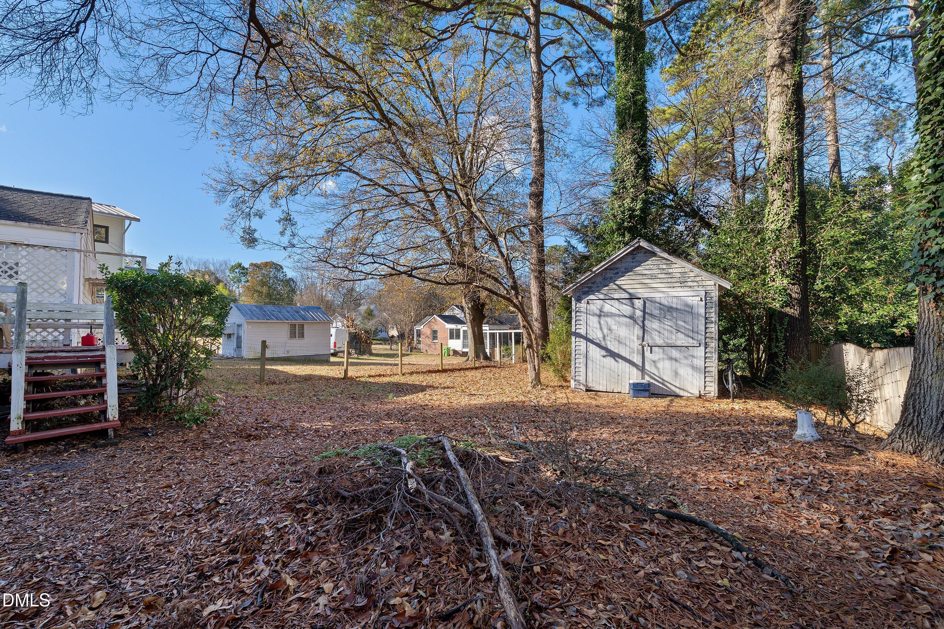 1205 Watauga Street Raleigh, NC 27604 - Photo 22 of 26 a front view of a house with a yard and garage