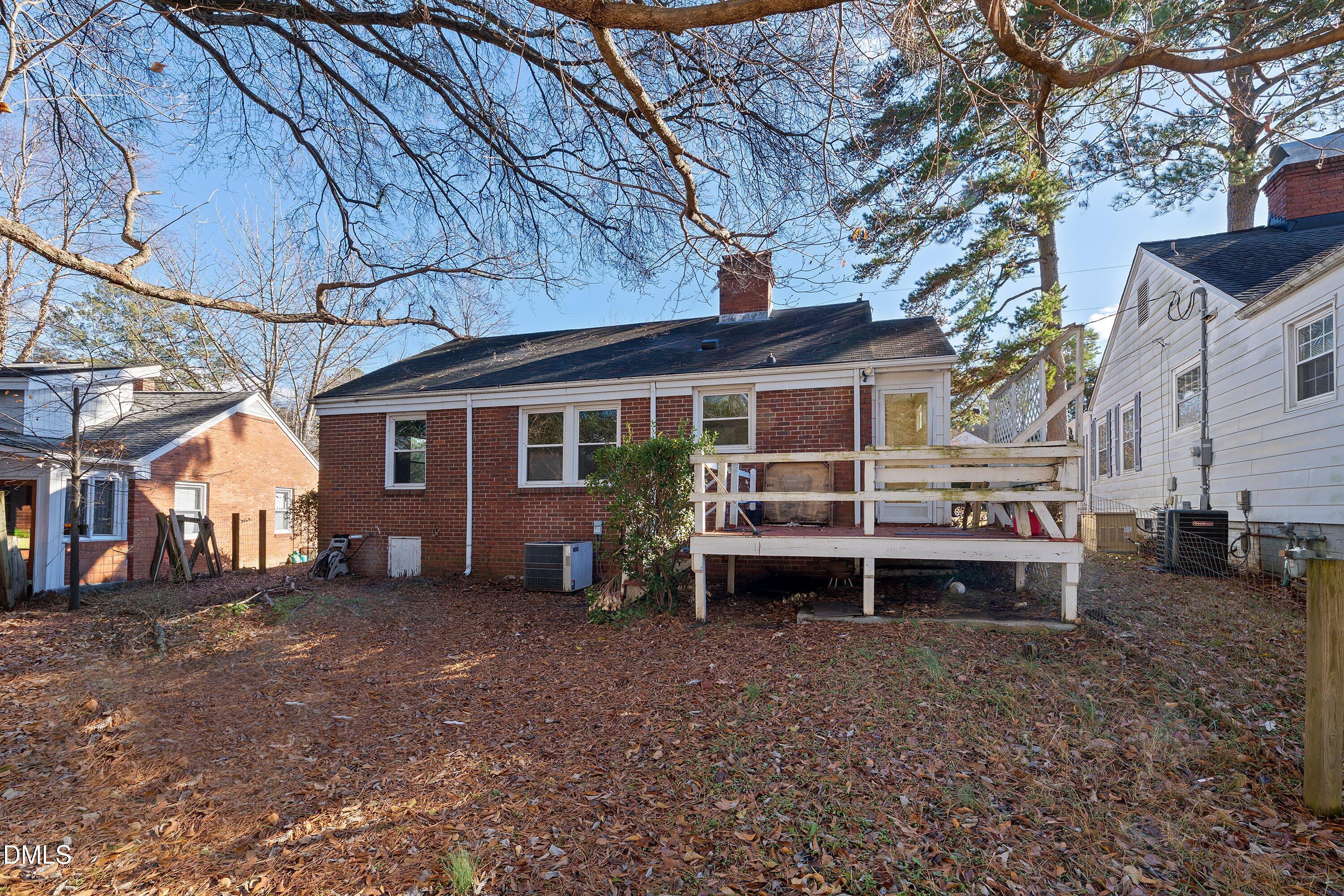 1205 Watauga Street Raleigh, NC 27604 - Photo 24 of 26 a view of a house with a yard and sitting area