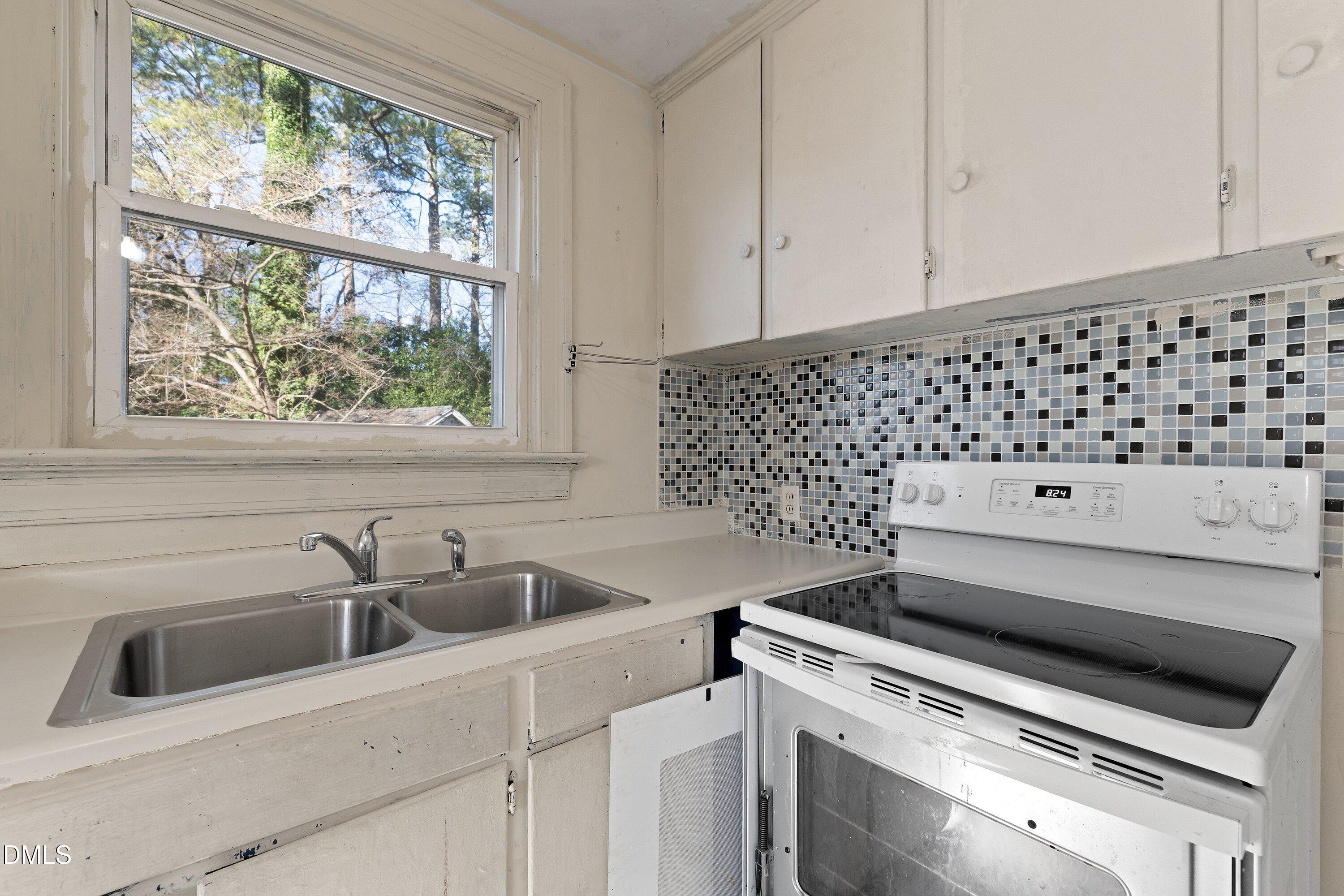 1205 Watauga Street Raleigh, NC 27604 - Photo 10 of 26 a view of a kitchen counter space with stove