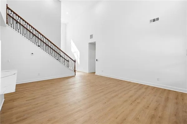 a view of staircase with wooden floor