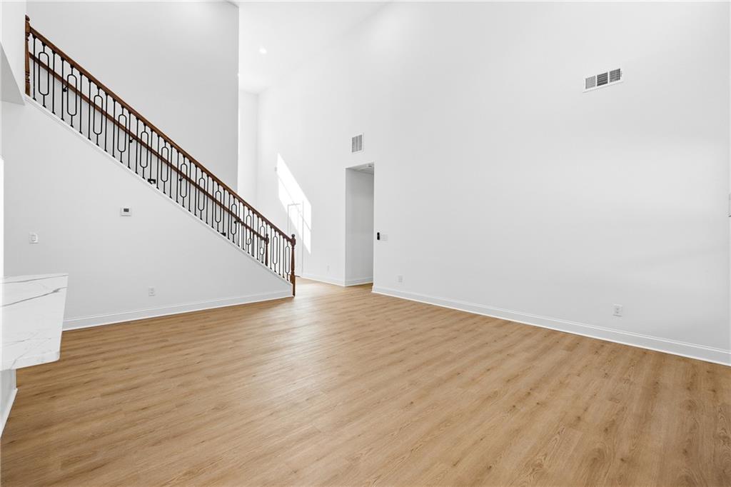 644 Hampton Road Hampton, GA 30228 - Photo 12 of 40 a view of staircase with wooden floor