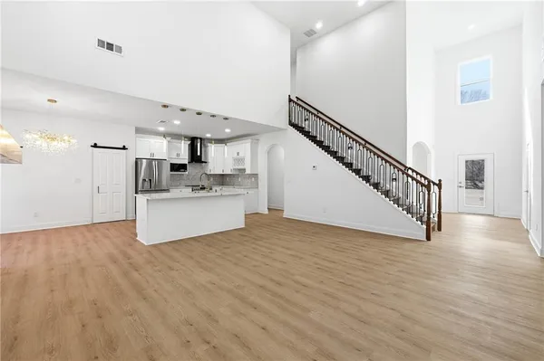 a view of kitchen with cabinets and wooden floor