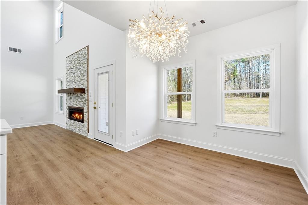644 Hampton Road Hampton, GA 30228 - Photo 18 of 40 a view of a big room with windows and chandelier