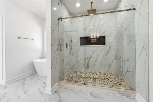 a bathroom with a shower and a toilet