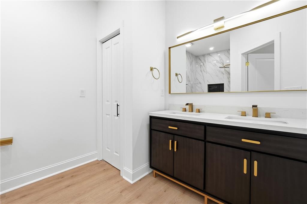 644 Hampton Road Hampton, GA 30228 - Photo 31 of 40 a bathroom with a sink and a mirror