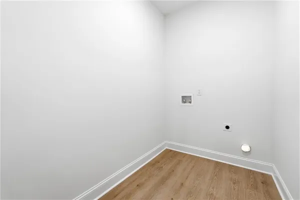 a view of a small space with wooden floor