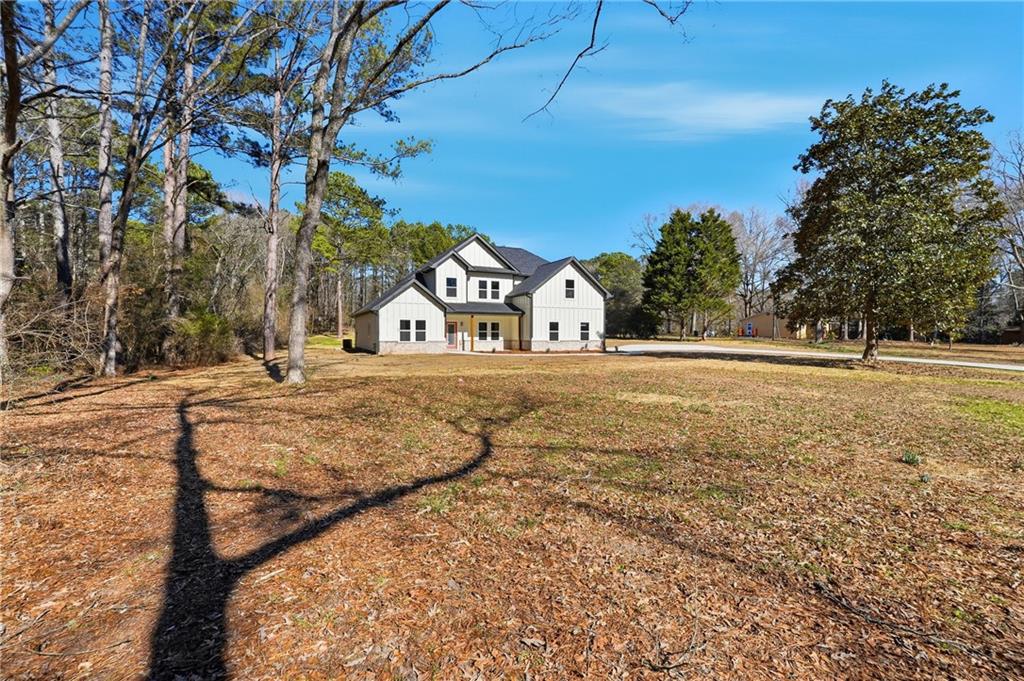 644 Hampton Road Hampton, GA 30228 - Photo 4 of 40 a view of a yard with large trees