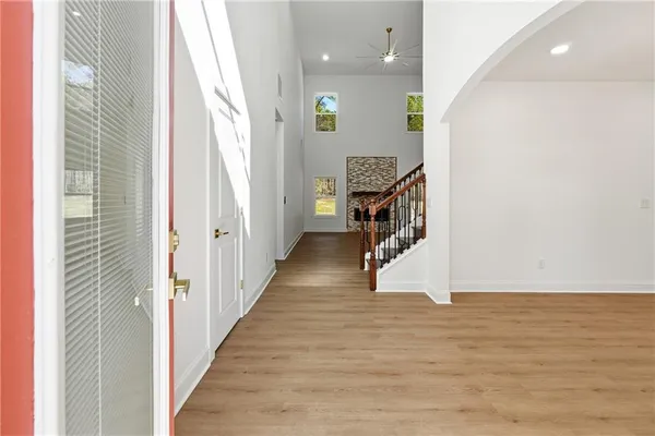 a view of hallway with wooden floor