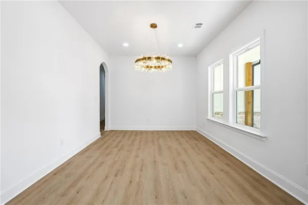 a view of an entryway with wooden floor