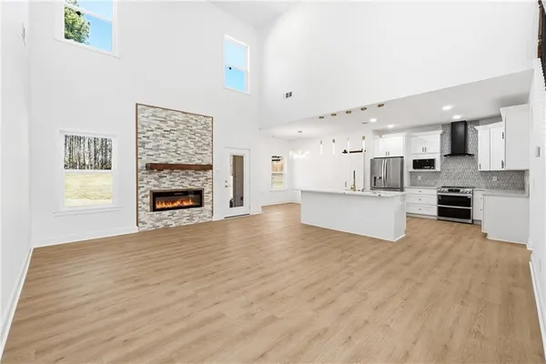a view of kitchen with furniture and a fireplace