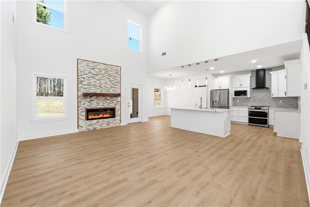 644 Hampton Road Hampton, GA 30228 - Photo 10 of 40 a view of kitchen with furniture and a fireplace