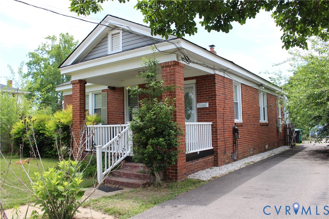 710 Colonial Avenue Colonial Heights, VA 23834 - Photo 2 of 14 a front view of house with pathway and yard