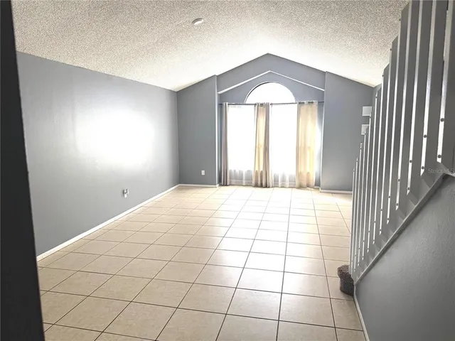 a room that has a bed and a window in it