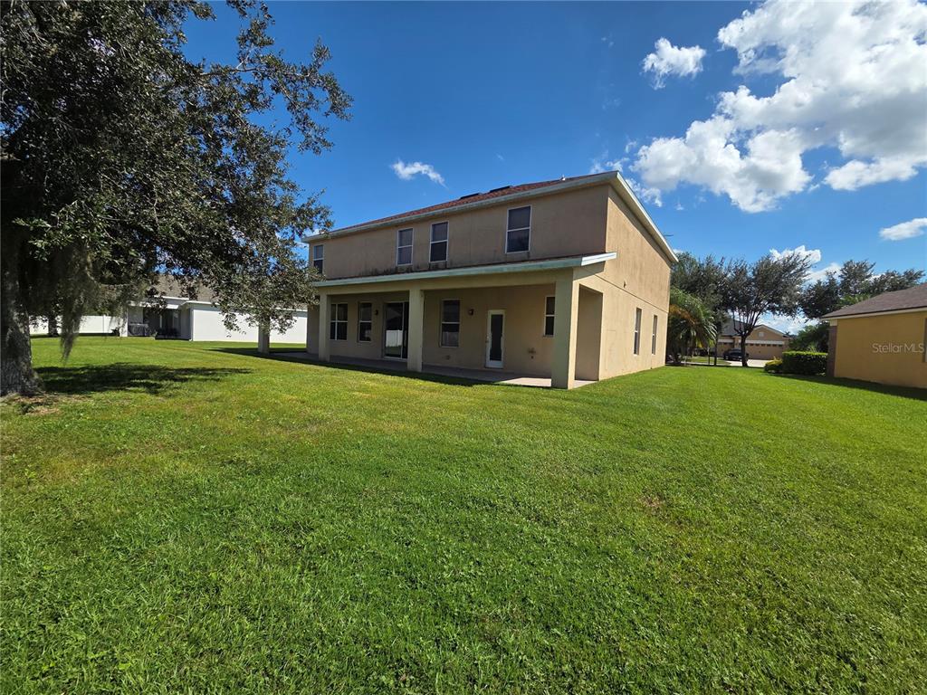 2400 Tybee Road St. Cloud, FL 34769 - Photo 15 of 15 a view of a house with a big yard