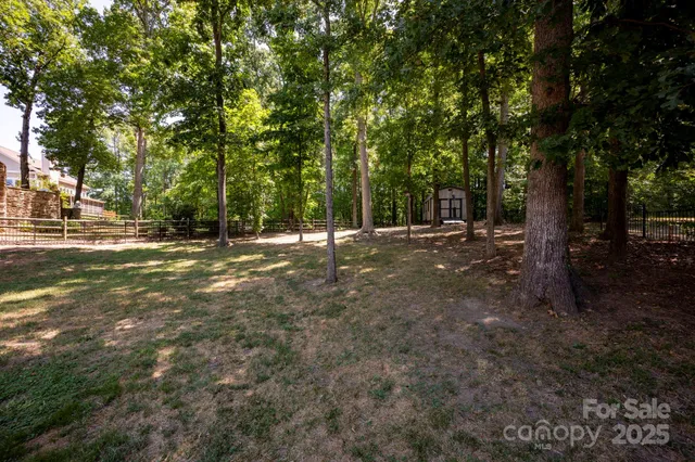 a backyard of a house with yard and outdoor seating