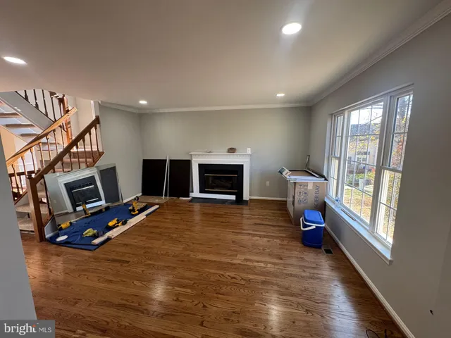 a bedroom with furniture and a fireplace