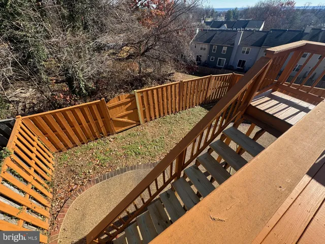 a view of balcony with wooden floor and stairs