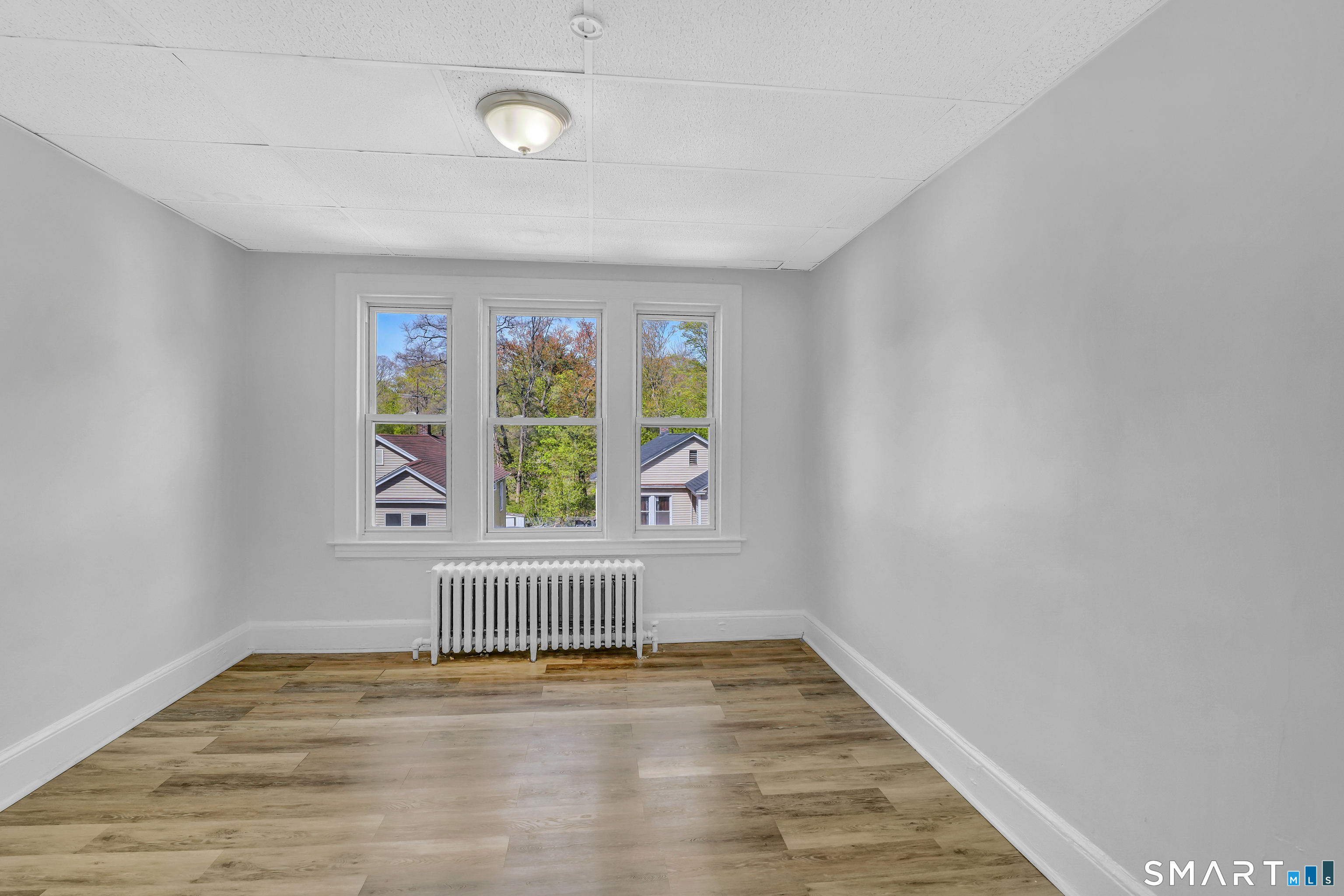 22 Harper Street, Unit 3 Hartford, CT 06112 - Photo 4 of 5 a view of an empty room with a window