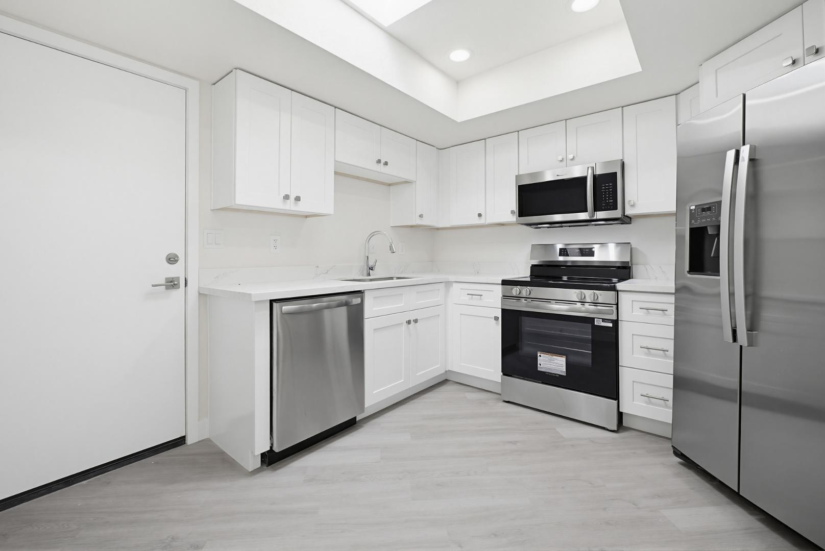 316 East Turquoise Avenue Phoenix, AZ 85020 - Photo 12 of 27 a kitchen with stainless steel appliances a stove a sink and a refrigerator