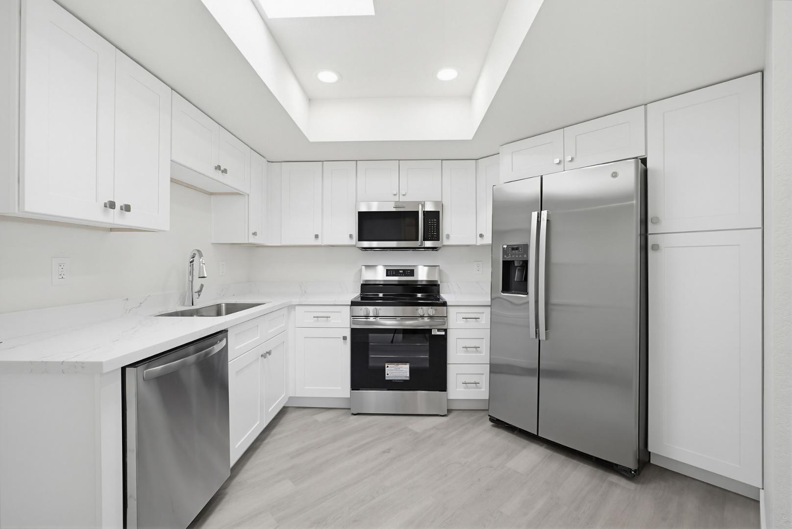 316 East Turquoise Avenue Phoenix, AZ 85020 - Photo 13 of 27 a kitchen with stainless steel appliances granite countertop a refrigerator stove and sink