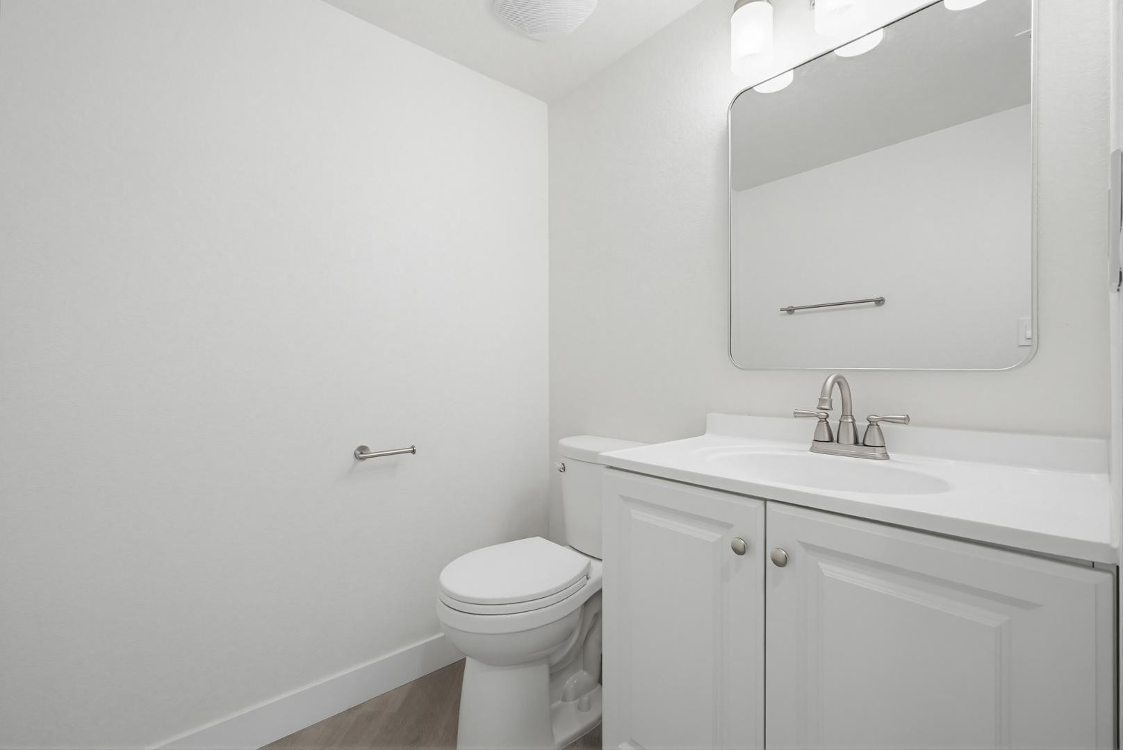 316 East Turquoise Avenue Phoenix, AZ 85020 - Photo 15 of 27 a bathroom with a sink a toilet and mirror