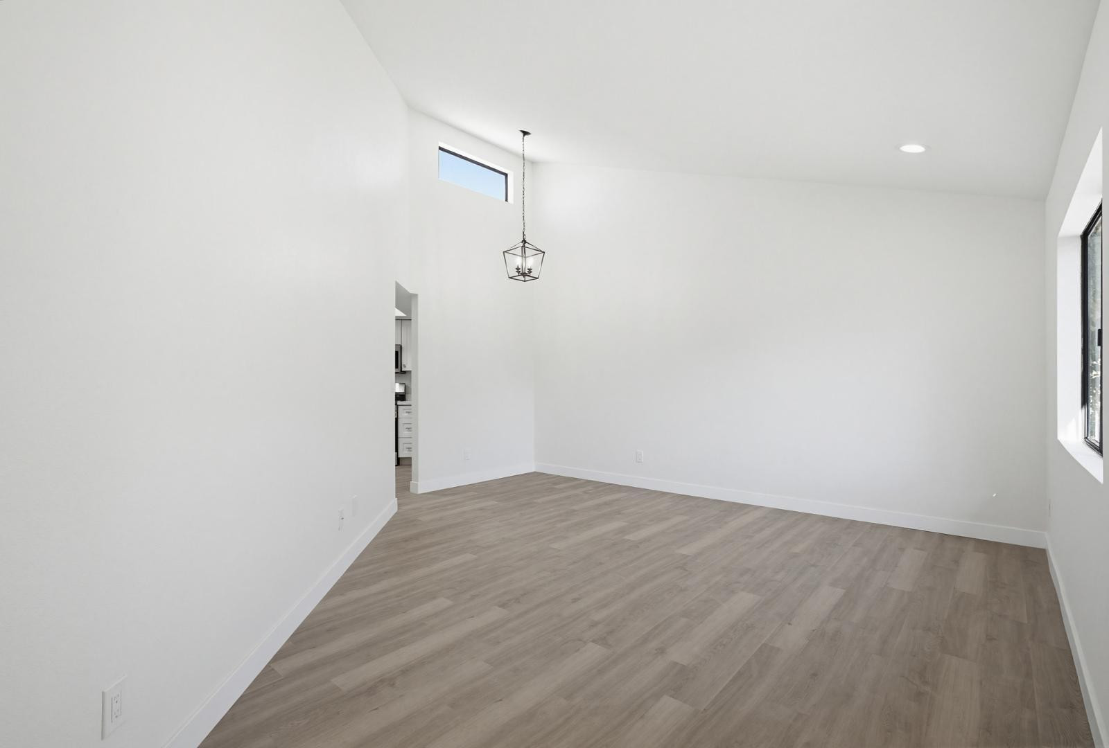 316 East Turquoise Avenue Phoenix, AZ 85020 - Photo 9 of 27 a view of a room with wooden floor and white walls