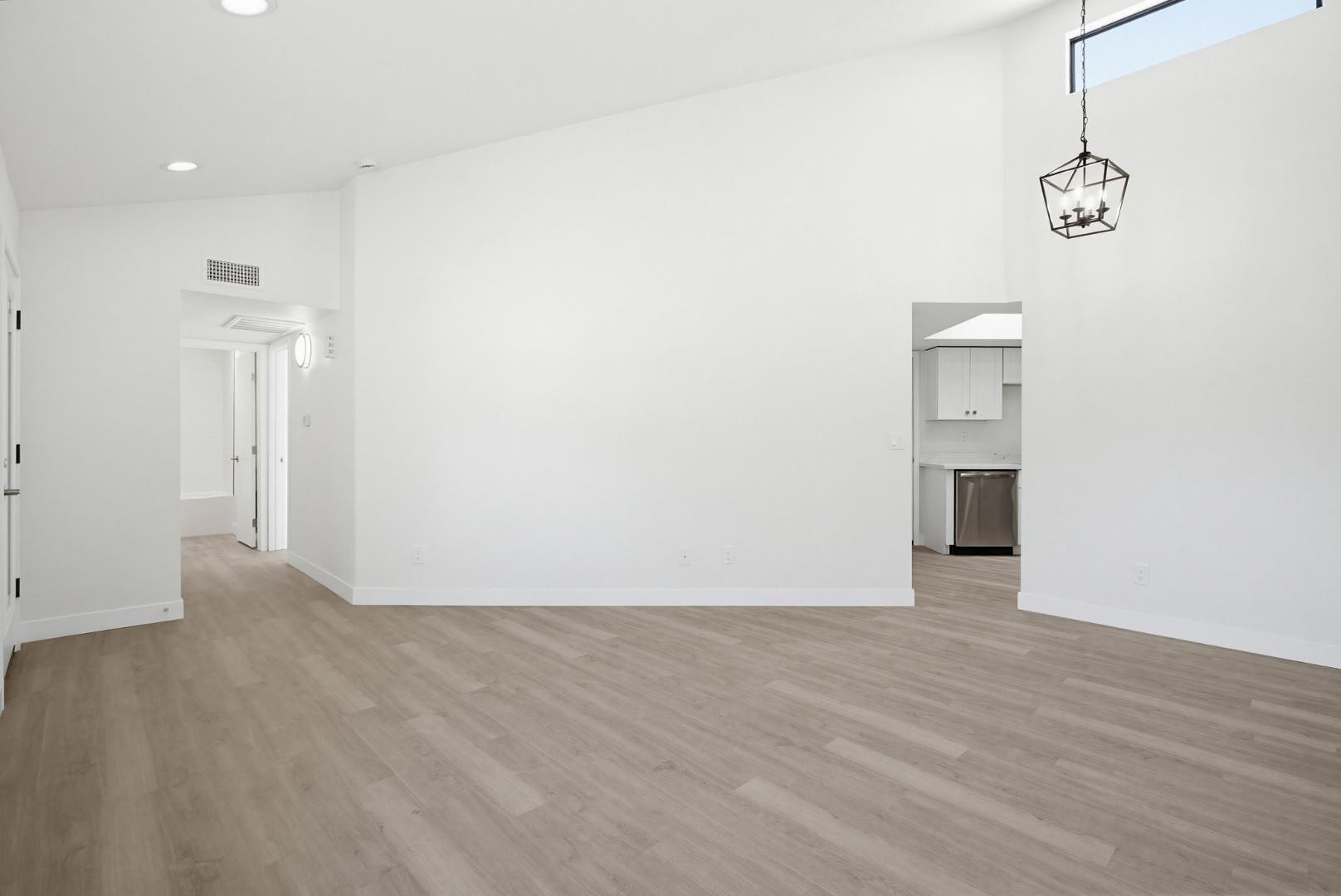 316 East Turquoise Avenue Phoenix, AZ 85020 - Photo 10 of 27 a view of an empty room with wooden floor and a window