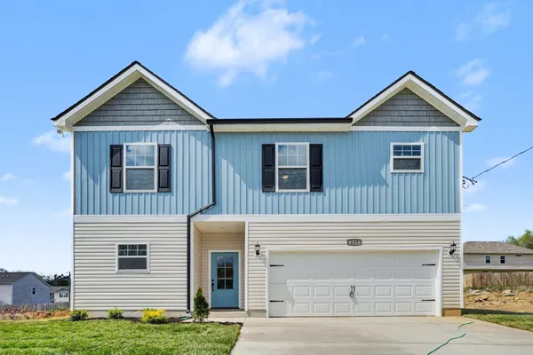 a view of a house of a house with garage