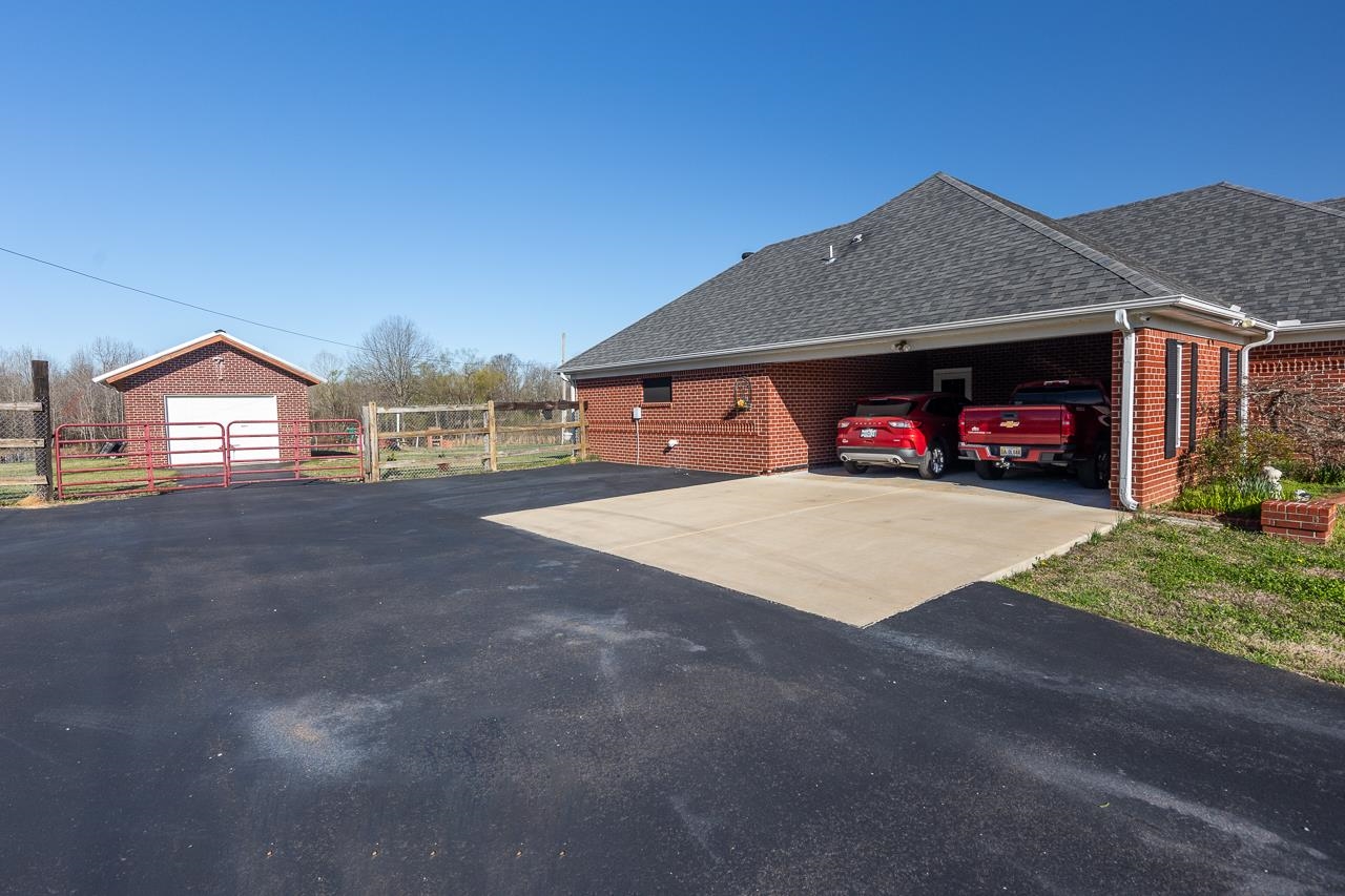 396 Woodview Road Byhalia, MS 38611 - Photo 17 of 23 a view of a house with a yard and garage