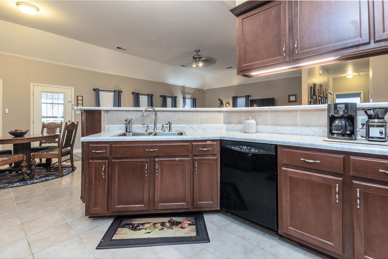 396 Woodview Road Byhalia, MS 38611 - Photo 7 of 23 a kitchen with a sink cabinets and wooden floor