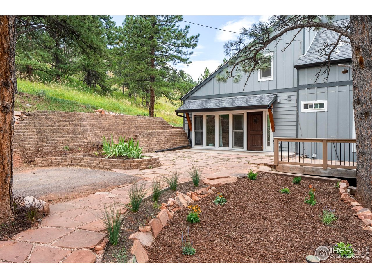6521 Olde Stage Road Boulder, CO 80302 - Photo 3 of 47 a backyard of a house with a yard and outdoor seating