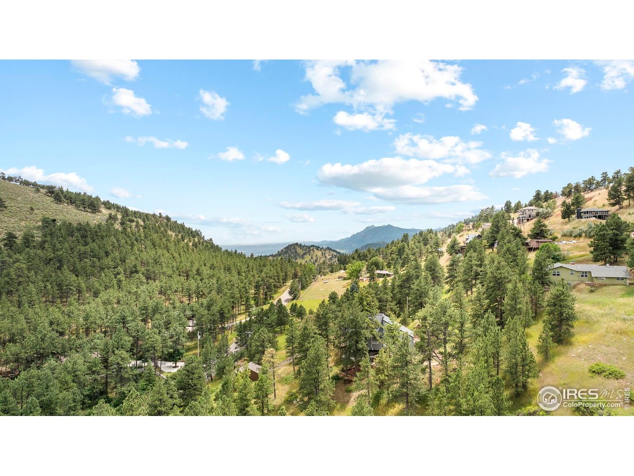 6521 Olde Stage Road Boulder, CO 80302 - Photo 45 of 47 a open area with mountains in the background
