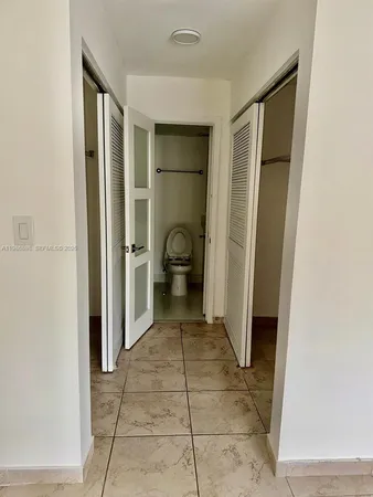 a bathroom with a shower and a toilet