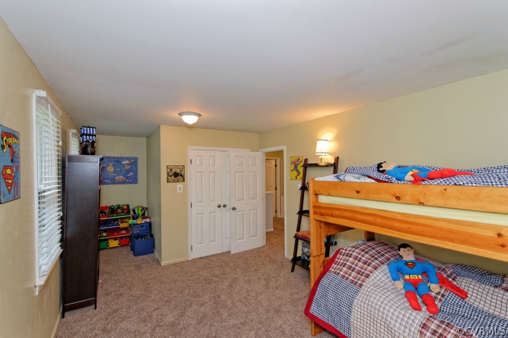 4908 Court Ridge Terrace Midlothian, VA 23112 - Photo 15 of 24 a bed room with a bed and a tv