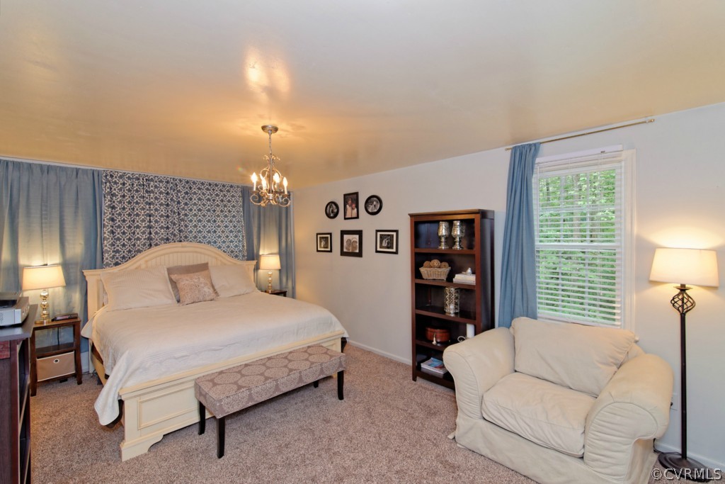 4908 Court Ridge Terrace Midlothian, VA 23112 - Photo 18 of 24 a bedroom with a large bed and a night stand